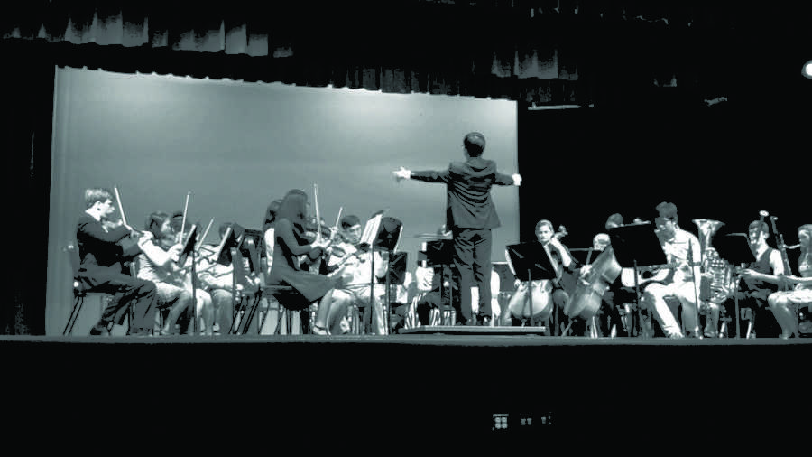 Joe+Chey+conducting+the+orchestra+during+their+performance+at+Oakton+for+the+Oakton+Jazz+Band+and+Senior+Solo+Concert.